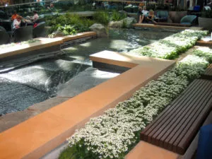 YVR international departure lounge custom precast concrete water feature seating wall coping Vancouver BC