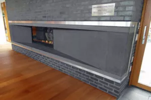 charcoal colour custom precast concrete fireplace surround Ronald McDonald House, Vancouver, BC
