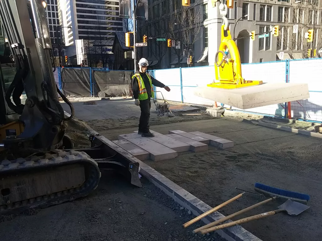 Large custom precast concrete paver being installed at Robson Square in Vancouver BC