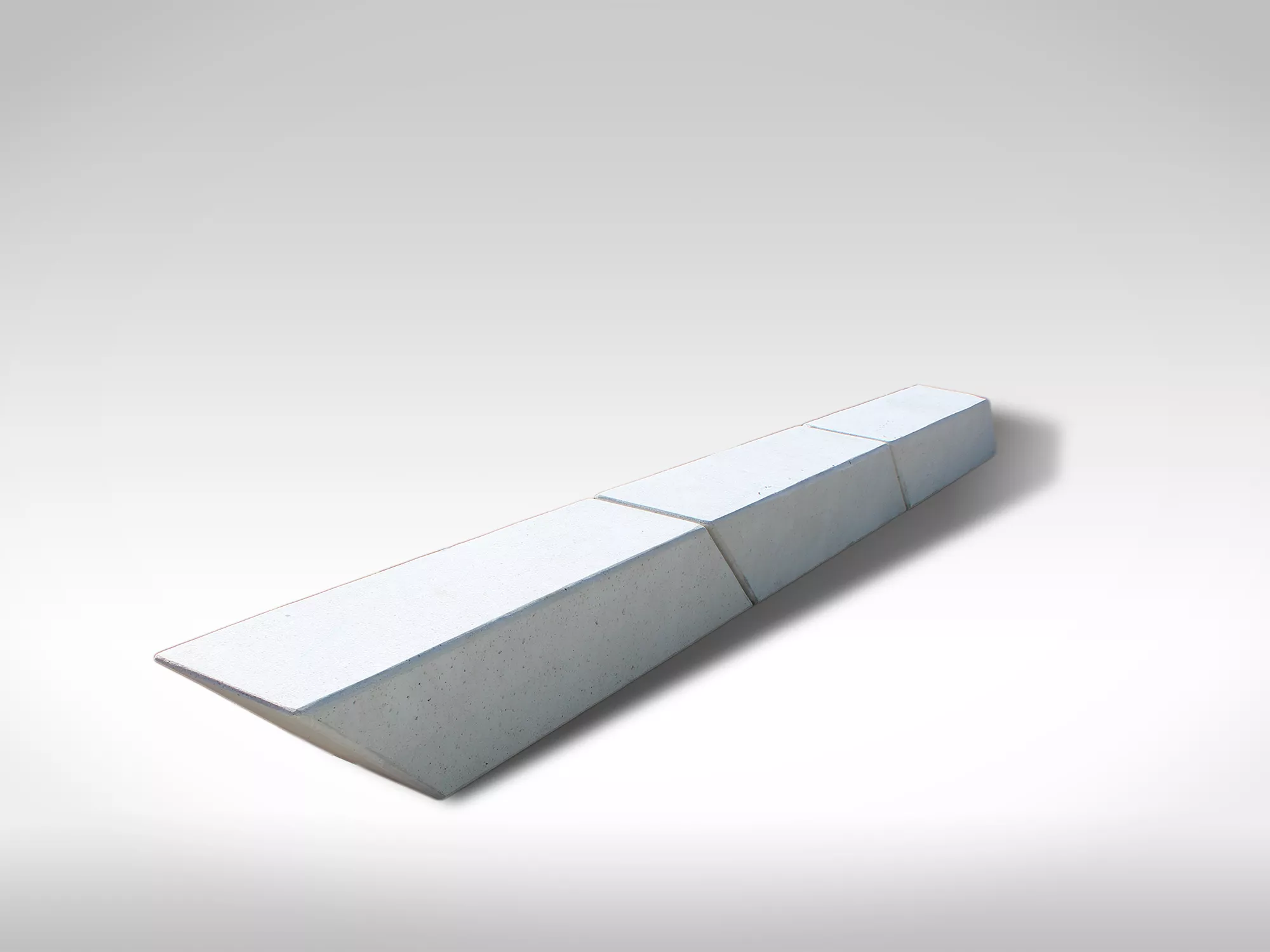 Sven angled segmental white precast concrete bench for public spaces
