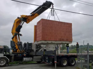 Loading the base assembly for the precast concrete washroom building at Sanderson Concrete Surrey BC