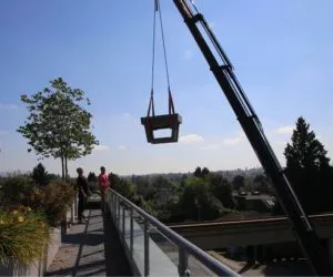 assembled precast concrete foosball table being delivered to a roof top garden