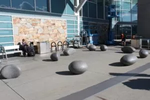 polished precast concrete pebbles benches security features vancouver airport