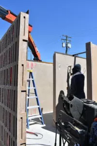 Assembling the toilet wall panel precast concrete washroom building Surrey BC