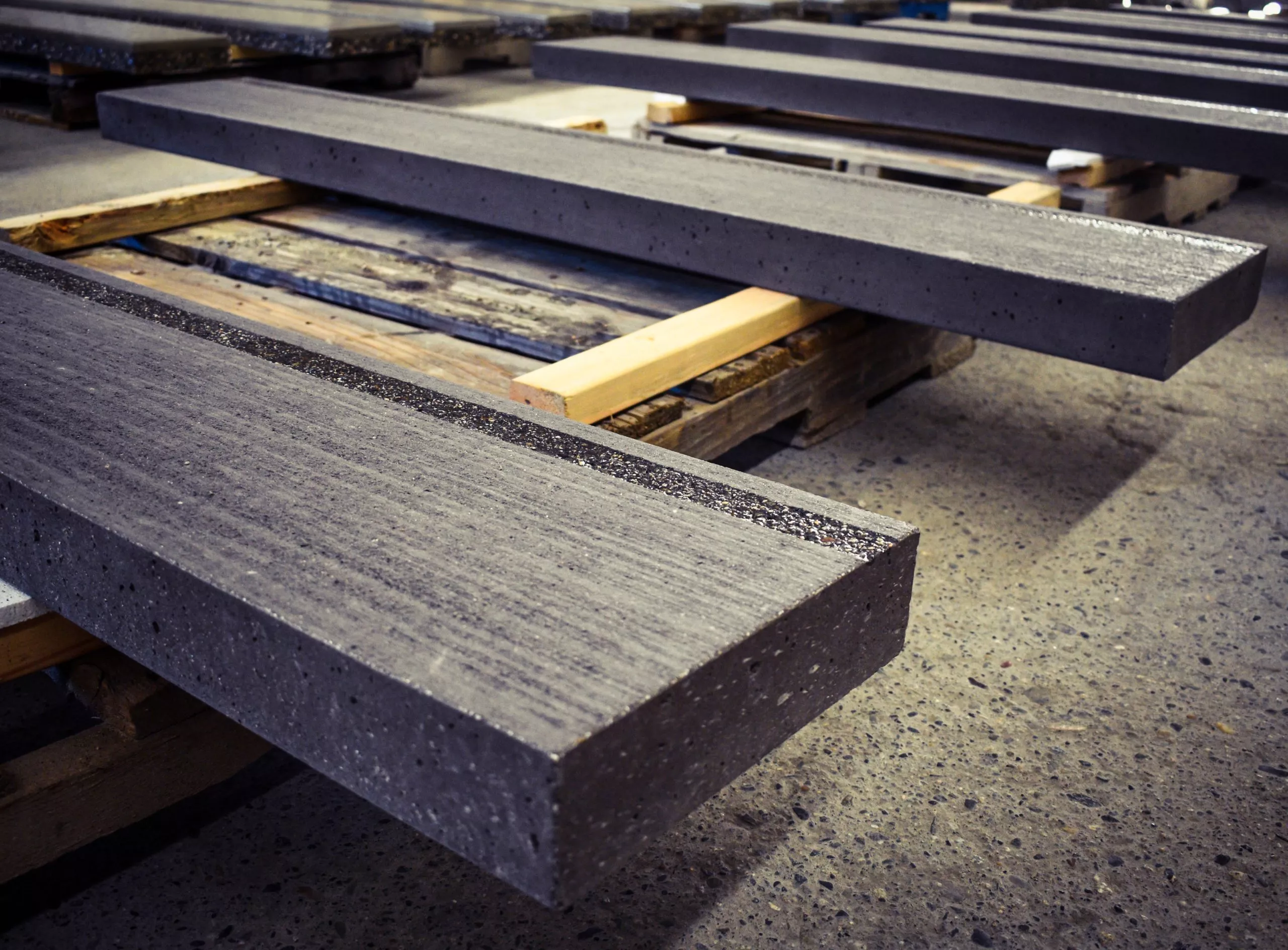 Precast concrete stair tread with grey carborundum nosing