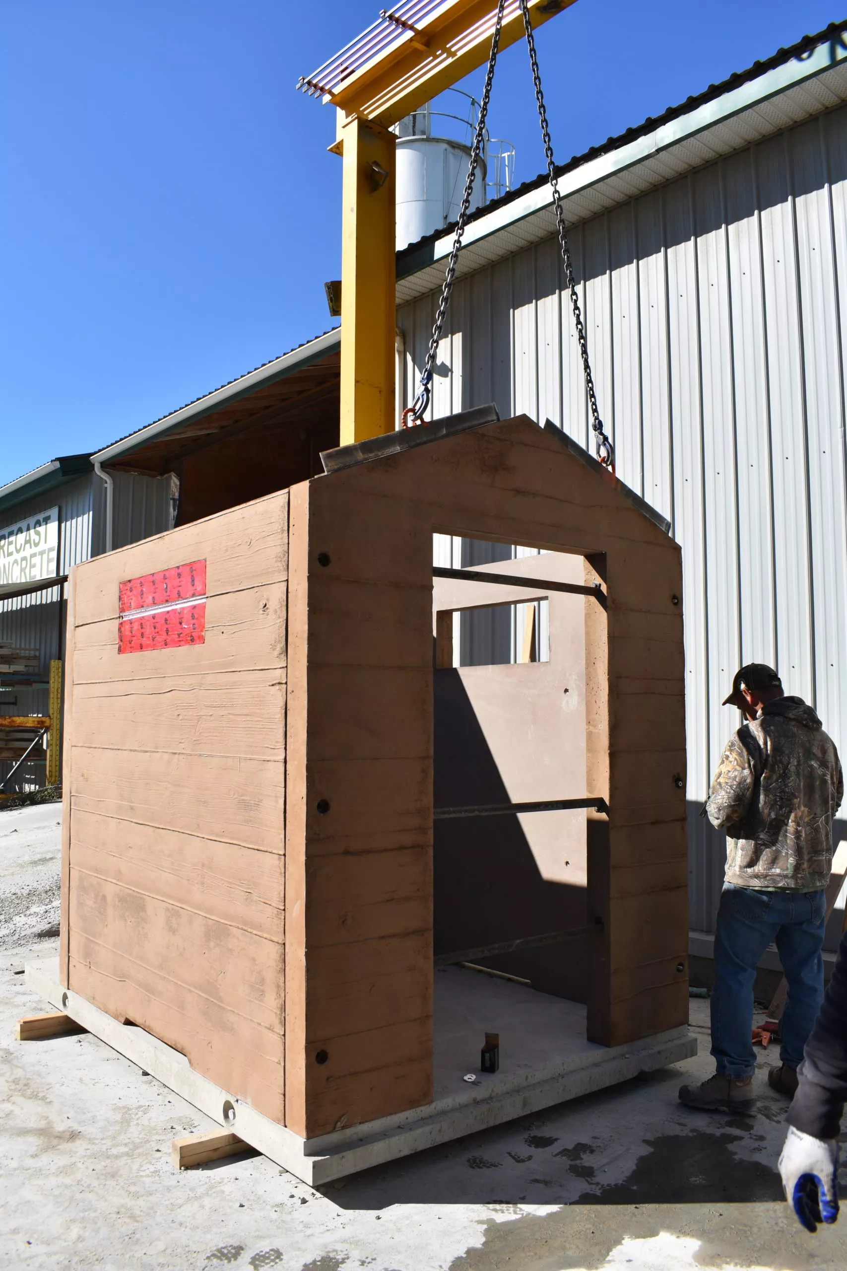 Precast concrete outhouse walls being assembled