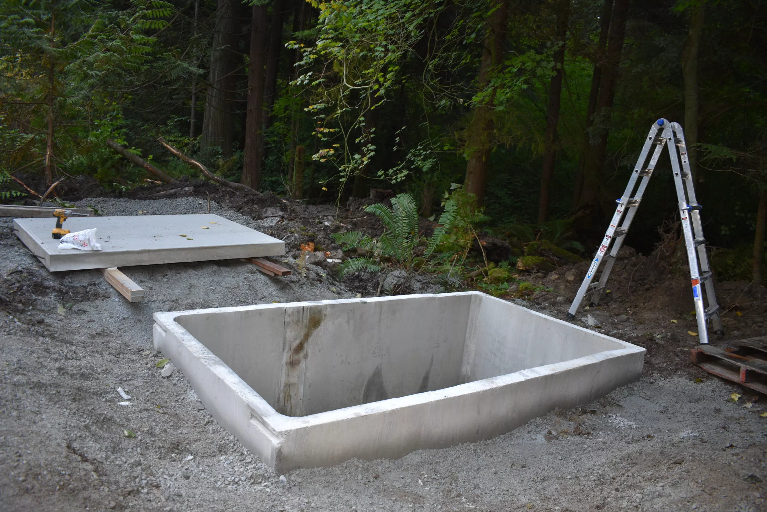 Concrete holding tank for precast outhouse installation