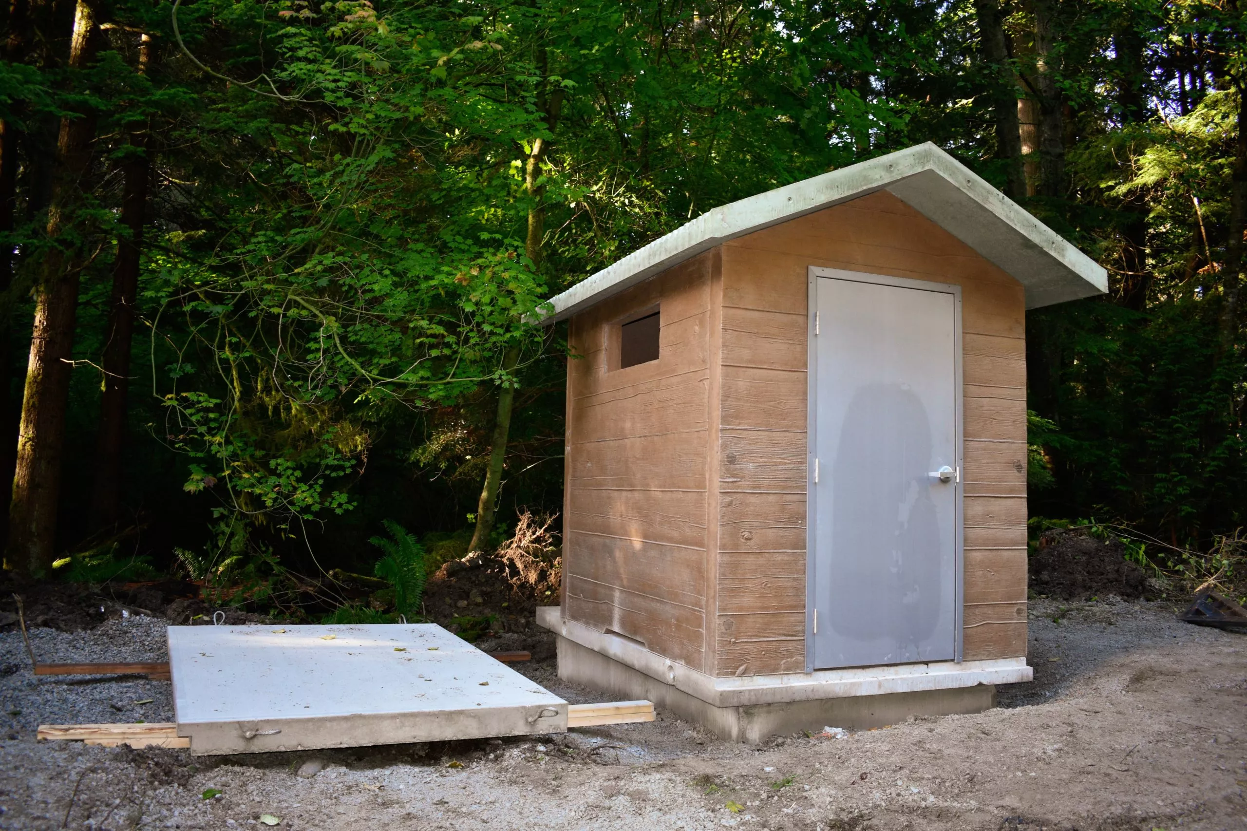 Completed precast concrete outhouse structure before delivery