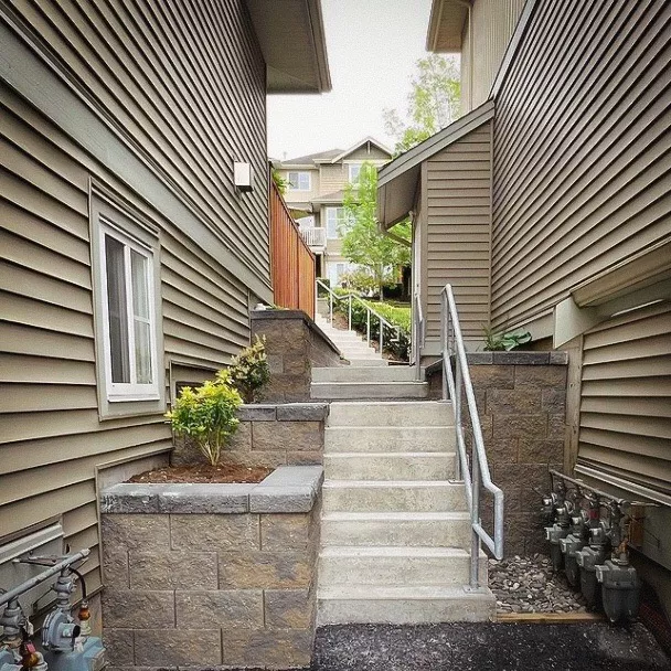 Roman concrete steps incorporated into a landscaped outdoor pathway