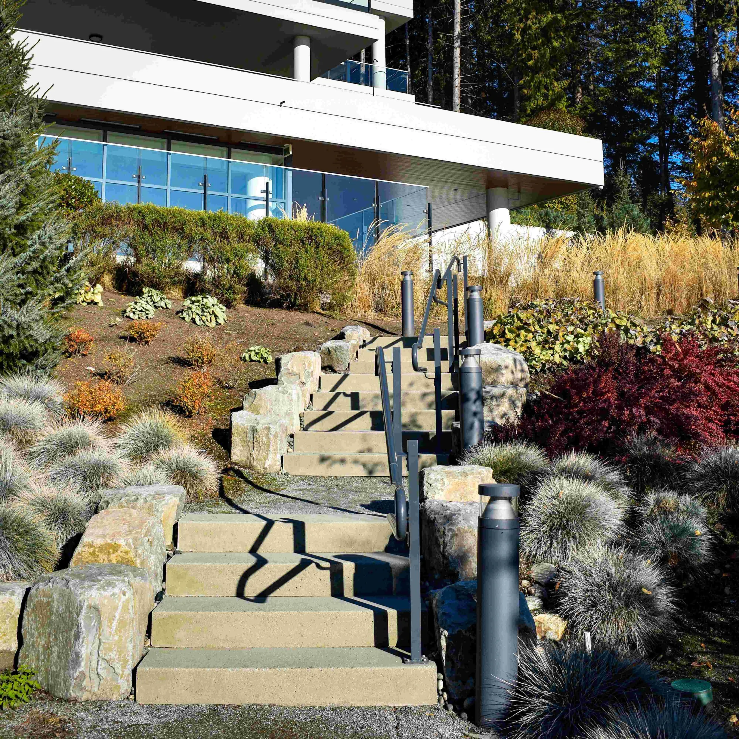 Precast outdoor concrete steps installed in a landscaped residential setting