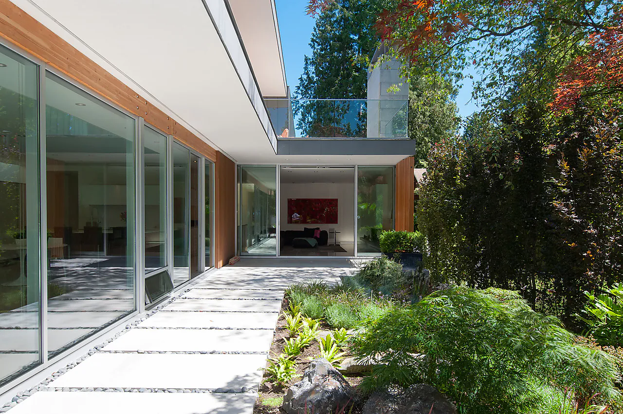 Precast concrete sidewalk slabs used in a pedestrian paving application